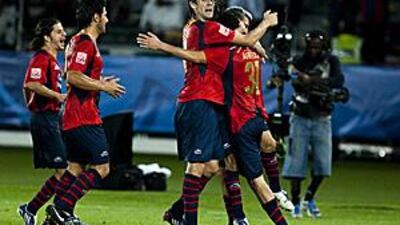 Atlante's Daniel Arreola, centre, is mobbed by his teammates after scoring his side's opening goal in the 3-0 victory over Auckland City in the Club World Cup quarter-final at Zayed Sports City last night.