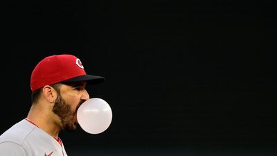 Cincinnati Reds third baseman Eugenio Suarez blows a bubble while standing in the field during the MLB game against the Washington Nationals at Nationals Park on Wednesday, May 26. Reuters