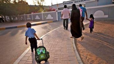 Students make their way to school along ‘headache road’ on Sunday morning.