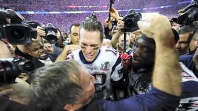 Head coach Bill Belichick, Tom Brady #12 and Le Garrette Blount #29 of the New England Patriots celebrate after defeating the Atlanta Falcons during Super Bowl 51 at NRG Stadium on February 5, 2017 in Houston, Texas. Getty images