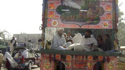 Families from a troubled area of Mir Ali along the Afghanistan border in Pakistan’s North Waziristan region arrive at Bannu, 190 kilometres from Peshawar. Mir Ali, the site of tribal tension and religious conflict, is the setting for Fatima Bhutto’s debut novel, The Shadow of the Crescent Moon. Ijaz Muhammad /AP Photo