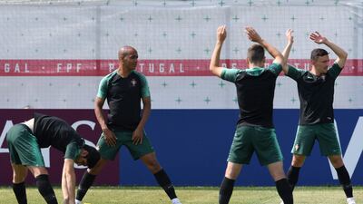 Portugal's players stretch during training. Francisco Leong / AFP