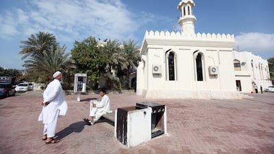 Two men chat before noon prayers on January 2, 2010, in the Al Zaab neighborhood of Abu Dhabi. Sammy Dallal / The National
