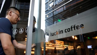 A man walks into a Luckin Coffee store in Beijing. Luckin, founded in 2017, raised $645m in its US IPO last year and counted BlackRock among its backers. Reuters