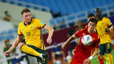 Vietnam's Nguyen Tien Linh, right, in action against Australia's Trent Sainbury. EPA