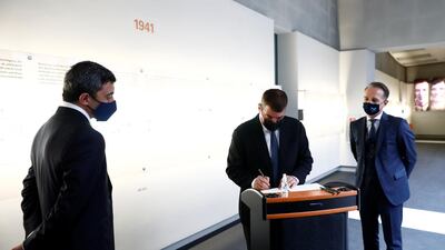 Both men left messages in the visitors book at the memorial. Reuters