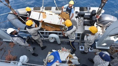 The wreckage of the K2 Airways Boeing 737 cargo plane is retrieved by Pakistani rescuers. Reuters