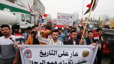 Iraqi protesters march during a anti-government protest in Tahrir square in the capital Baghdad, on December 15, 2019. AFP