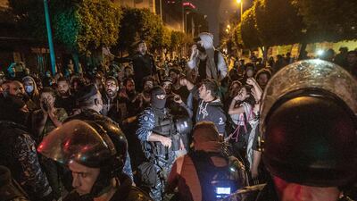 Anti-government protesters shout slogans during a protest against the collapsing Lebanese currency and the price hikes of goods, in front the central bank in Beirut, Lebanon. EPA