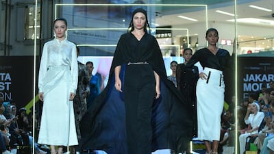 Indonesian models present creations by designer Araida of Russia during Jakarta Modest Fashion Week. AFP