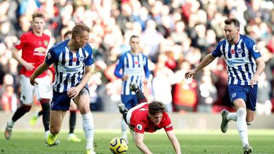 Manchester United's Daniel James has a tough time against Brighton and Hove Albion's Dan Burn at Old Trafford. Reuters