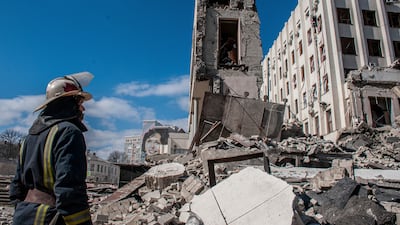 Rescuers work at the site of the National Academy of State Administration building damaged by shelling in Kharkiv. AP