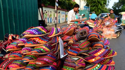 Decorative traditional footwear on sale for Navratri in Ahmedabad. AFP