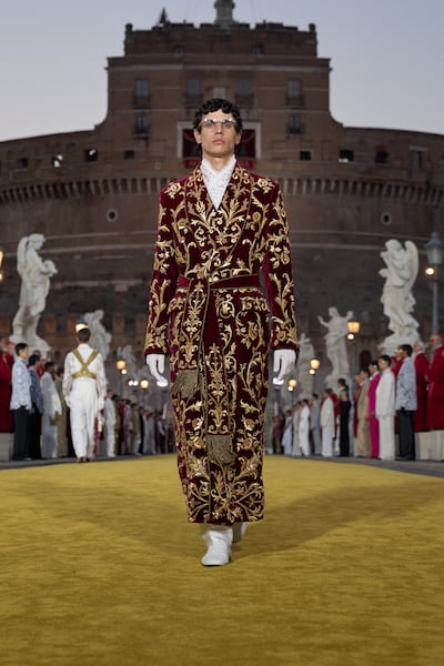 Ecclesiastical motifs included red cassocks, brass thuribles and fascia sashes. Photo: Dolce & Gabbana