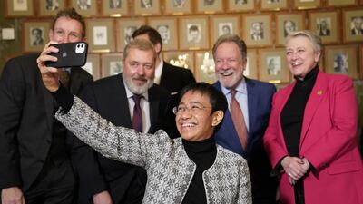 Ressa takes a selfie with the Nobel Committee and Dimitrij Muratov, who she shared the Nobel Peace Prize with, in Oslo in December 2021. AFP