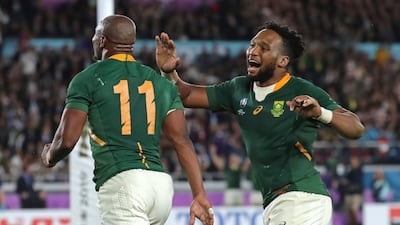 Makazole Mapimpi, left, celebrates with Lukhanyo Am after scoring South Africa's try against England in the Rugby World Cup final. AP Photo
