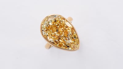 A light yellow pear-shaped diamond ring