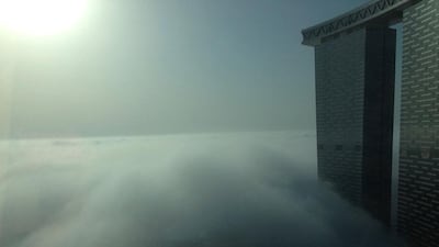 View from Sun Towers in Abu Dhabi - fog blankets the capital on March 10, 2014. Courtesy Maria Cristina Tamayo