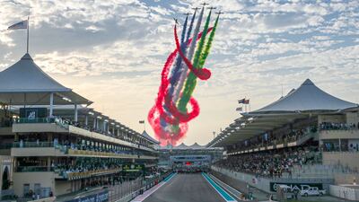 Al Fursan aerial display team above Yas Marina Circuit in their Aermacchi MB-339A jets joined by Etihad Boeing 737 before the start of the Etihad Airways Abu Dhabi Grand Prix, on November 20, 2022. Victor Besa / The National