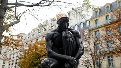 The Sculpture 'The Thinker' is displayed on the Avenue George V. It is now on loan to Louvre Abu Dhabi. AFP