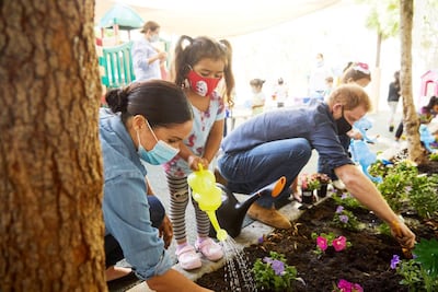 Prince Harry and Meghan Markle plant flowers and forget-me-nots during a visit to the Assistance League Los Angeles' Preschool Learning Centre in Los Angeles. Reuters