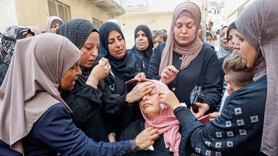 Mourners console the mother of Palestinian Mateen Dbaya, who was killed during an Israeli forces raid in Jenin refugee camp, during his funeral in the Israeli-occupied West Bank. Reuters