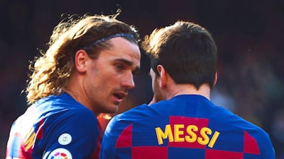 Lionel Messi (R) celebrates with teammate Antoine Griezmann. EPA