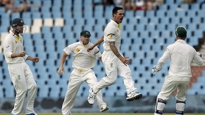 Australia's Mitchell Johnson, second right, celebrates the dismissal of South Africa's Faf du Plessis during Day 2 of the first Test on Thursday. Siphiwe Sibeko / Reuters
