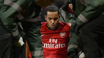 Theo Walcott came off after a Danny Rose tackle on Saturday. Dylan Martinez / Reuters