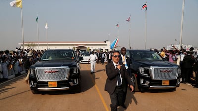 Security officers clear the way as Pope Francis's convoy leaves the airport. Reuters