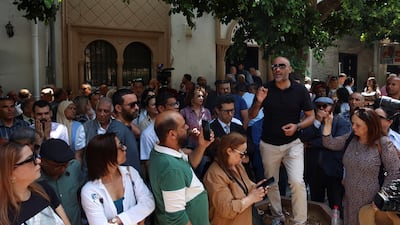 Journalists protest outside the Palace of Justice in Tunis during the trial of IFM radio journalists Mourad Zghidi and Borhen Bsaies. Reuters