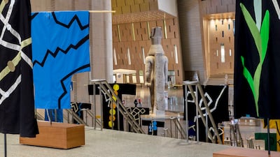 Hefuna's Traces of Egypt costumes are on display with the statue of Ramses II in the background