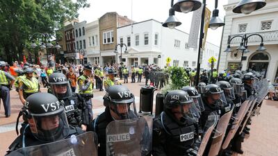 Virginia State Police cordon off an area around the site where a car ran into a group of protesters after a white nationalist rally in Charlottesville, Virginia