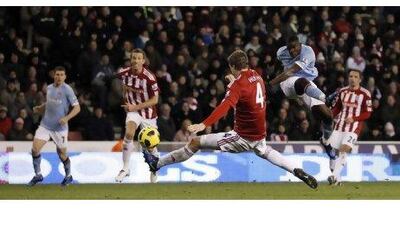 Micah Richards, right, puts Manchester City in front against Stoke City at the Britannia Stadium yesterday.