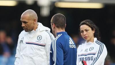 Chelsea's striker Fernando Torres, centre,talks to assistant first team coach Jose Morais, left, and former first team doctor Eva Carneiro as he warms up for a match at the Stamford Bridge Stadium in London, Britain, 08 March 2014. EPA/KIERAN GALVIN