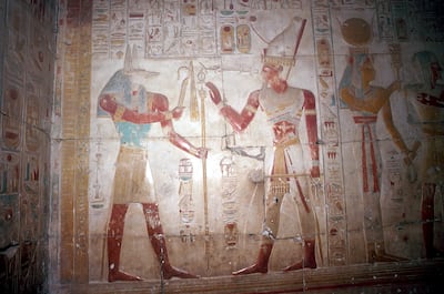 Painted relief of Sethos before Anubis (jackal headed god) at the Temple of Sethos I, Abydos, Egypt, 19th Dynasty, c1280 BC. Getty Images