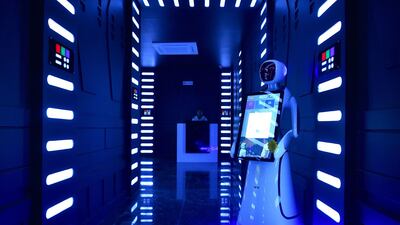 An interactive Android robot stands in the corridor. AFP