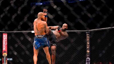Derrick Lewis kicks Ciryl Gane during their Heavyweight bout. AFP
