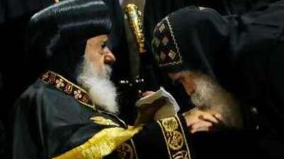 An Egyptian monk kisses the hand of Pope Shenouda III, the ailing head of Egypt's Coptic Orthodox Church, before he gives a sermon at Cairo's St. Mark's cathedral.
