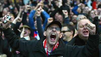 Crystal Palace fans celebrate after the opening goal during their club;s Premier League draw against West Brom on Saturday. Laurence Griffiths / Getty Images