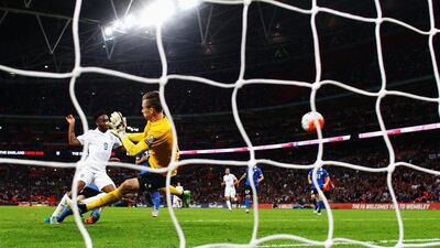 Raheem Sterling of England shoots and scores their second goal in a Euro 2016 qualifying win on Friday night over Estonia. Julian Finney / Getty Images