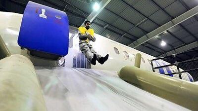 Staff of the GAA demonstrate emergency exit slide. Phil Weymouth for The National