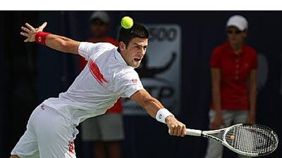 Novak Djokovic, the world no 2, returns a backhand on his way to winning the Dubai Championship against Mikhail Youzhny.