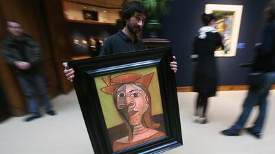 Picasso's Femme Au Chapeau at a Christie's London sale in January 2008. Getty Images