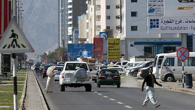 Pedestrians cross the Hamad Bin Abdullah Street section of the E99 ‘death road’ in Fujairah. Satish Kumar / The National