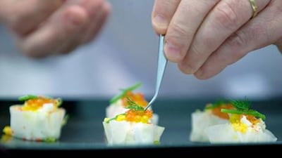 Bruno Ménard prepares a Singapore crab ‘siew mai’ at a Gourmet Abu Dhabi masterclass at the Armed Forces Officers Club. Silvia Razgova / The National