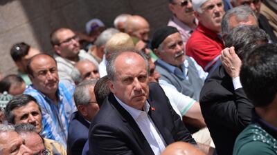 Muharrem Ince, a lawmaker with Turkey's main opposition Republican People's Party, CHP, and the party's presidential candidate, prays with supporters as he begins his campaign in Ankara, Turkey, on May 4, 2018. AP