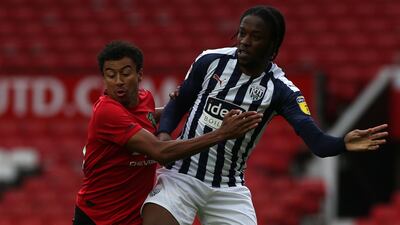 Jesse Lingard battles for the ball. Getty