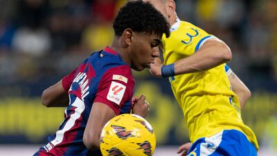 Lamine Yamal's ability to dribble past players have earned him comparisons with Lionel Messi, something not welcomed by his coach, Xavi. AFP