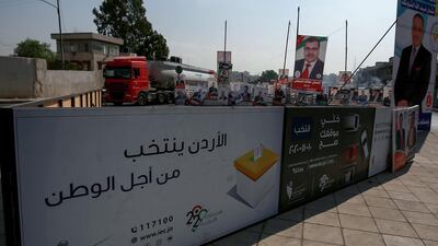 Campaign banners and slogans of candidates for the upcoming Jordanian parliamentary elections line a street in the capital Amman. AFP